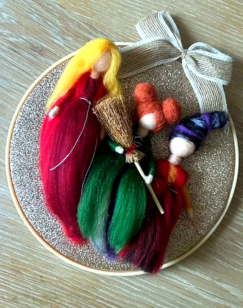 Needle-felted witch sisters in a wooden embroidery hoop