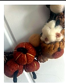 Autumn wreath with pumpkins and a mouse