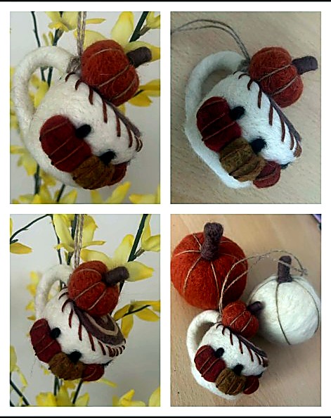 Autumnal pumpkin mug ornament hanging among yellow blossom